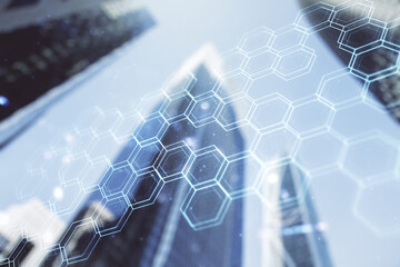Poster - Double exposure of abstract virtual technology hologram with hexagon on modern skyscrapers background. Research and development software concept