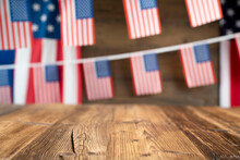 Fourth Of  July. Independence Day Concept. American Flags On The Wooden Rustic Table.