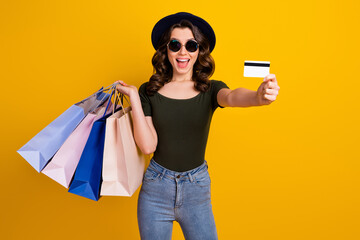 Canvas Print - Portrait of her she nice attractive lovely pretty overjoyed cheerful wavy-haired girl carrying new things giving unlimited bank card isolated on bright vivid shine vibrant yellow color background