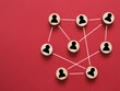Abstract teamwork, network and community concept on a red paper background