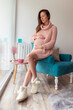 © Impact Photography - Pregnant woman relaxing at home