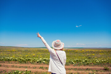 
girl in a hat in the field