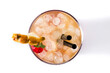 Cold mai tai cocktail with pineapple and cherry isolated on white background. Top view