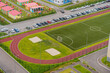 Aerial view of modern residential complex with a sports field and a playground. High quality photo