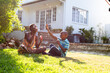 African American woman and her son, spending time together in the garden