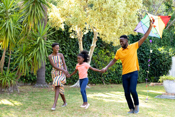 Wall Mural - African American family spending time together in their garden. 