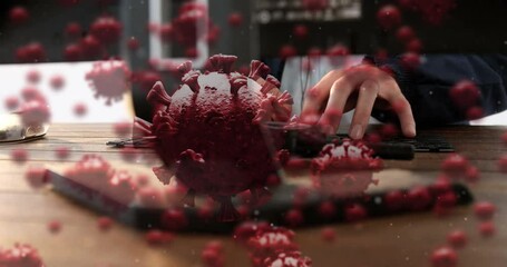 Poster - Digital composite video of Covid-19 cells moving against person typing on keyboard in background
