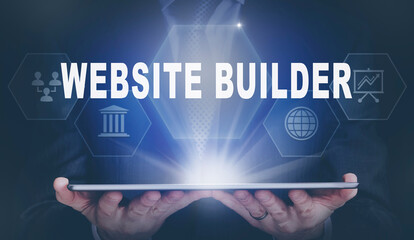 Businessman holding a computer tablet display projecting a Website Builder concept.