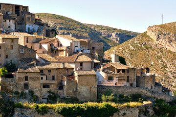 Wall Mural - During sunny warm day view to the old obsolete rural houses of Bocairent hillside village placed in north west of Mariola mountain. Vall d'Albaida in Valencian Community, Espana, Spain