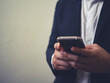 © Kenstocker - close up of business man using smartphone, concept of technology for business, network online.