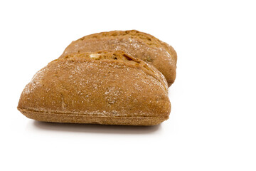 Two rolls of wheat and rye flour, with seeds. Delicious bread. Isolated on a white background.