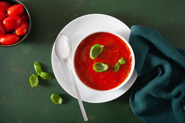 Wall Mural - tomato and bell pepper vegetarian soup on green background