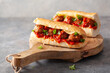 © Olga Miltsova - meatball sub sandwich with cheese and marinara tomato sauce. american italian fast food