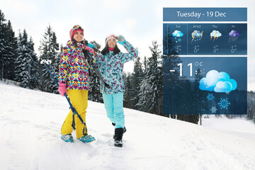 Wall Mural - young skiers outdoors and weather forecast widget. mobile application