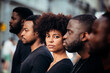 © Victor Torres/ADDICTIVE STOCK - Black people on street with serious expression. The woman is looking at camera