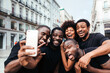 © Victor Torres/ADDICTIVE STOCK - Group of black race friends taking a selfie