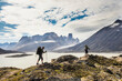 © Cavan Images - Backpackers traverse a mountain ridge in Akshayak Pass, Baffin Island.