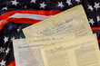 Close up of a replica of U.S. document of American constitution We the people with USA Flag.