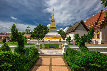 Background of an important tourist attraction in Khon Kaen, where tourists come to see the beauty always (Phra That Kham Kaen) is an old pagoda and has a beautiful golden yellow color, in Thailand