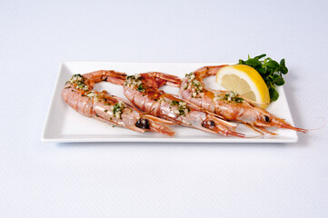 A plate of Norway lobsters on a white background