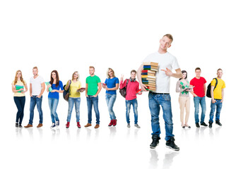 Wall Mural - Large group of teenage students isolated on white background. Many different people standing together. School, education, college, university.