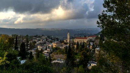 Wall Mural - Ein Karem, biblical birth place of John the Baptist, with Catholic Church of Saint John the Baptist; beautiful time lapse of moving clouds; Jerusalem Israel