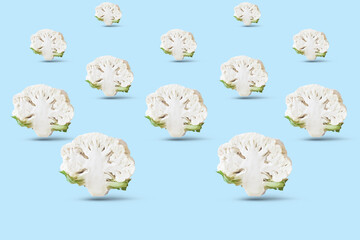 Wall Mural - Cauliflower on blue background. Seamless minimalistic isometric pattern, photo collage, vegan pop art design, vegetable backdrop. Postcard, print on fabric, wrapping paper.