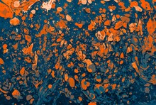Closeup Shot Of An Abstract Painting Made Up Of Orange And Blue Colors