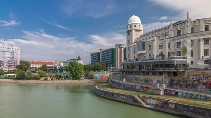 Wall Mural - Urania and Danube Canal timelapse hyperlapse in Vienna at sunny summer day. Urania is a public educational institute and observatory