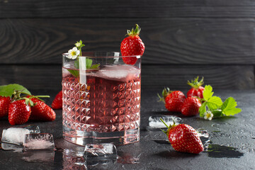 Wall Mural - Fresh strawberry cocktail with ripe strawberries and ice cubes.Strawberry lemonade.Close up.