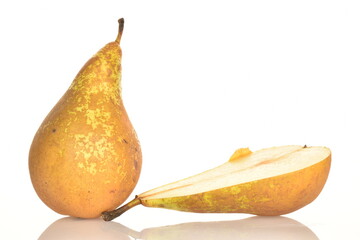 Ripe organic pears, close-up, on a white wooden table.