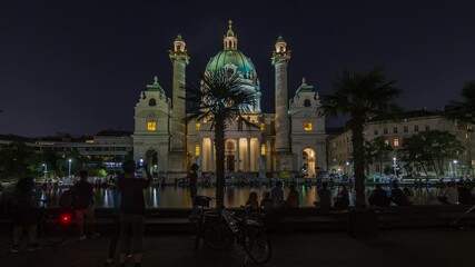 Sticker - Karlskirche on the Karlsplatz square night timelapse hyperlapse in Vienna, Austria. People walking and sitting at fountain. It is a catholic church, also called Rektoratskirche, with a typical baroque