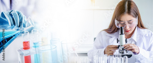 Cuadros en Lienzo Asian scientist woman lab technical service observe liquid sample with lab glass