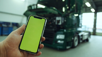 Smartphone in truck workshop