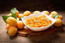 Bowl Of Canned Apricots And Fresh Fruits