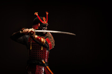 Portrait of a samurai in armor in attack position