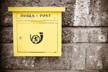 Yellow Post Box On Wall
