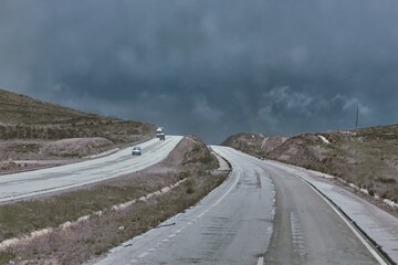 Poster - Picture of cars on the street under the grey sky