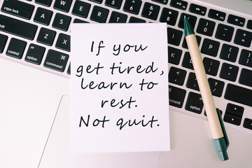 Wall Mural - Life inspirational and motivational quotes written on white paper with word - If you get tired, learn to rest. Not quit.