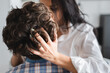 © LIGHTFIELD STUDIOS - Selective focus of woman touching hair of boyfriend