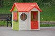 A small children's playhouse for playgrounds and parks.