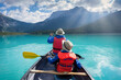 © romylee - father and son canoeing in Emerald lake in the Canadian rockies