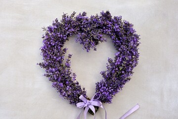 Wall Mural - Lavender heart wreath on white background close-up