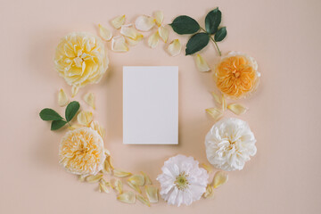 Framework for photo or congratulation. Blank paper mock up with floral composition.