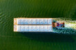 Overhead view of a shipping barge moving through the intercoastal waterway