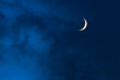 Blue foggy sky with crescent or half moon