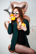 © ostap_davydiak - girl with dark hair wearing a bathing suit sexy model posing with a pineapple.