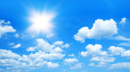 Wall Mural - sunny background, blue sky with white clouds and sun