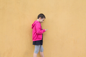 girl with short hair using mobile or cell phone