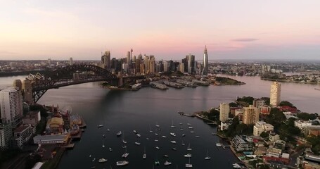 Poster - Sunrise in Sydney city from altitude or aerial mid-air flying over Lavender bay facing CBD waterfrtont.
